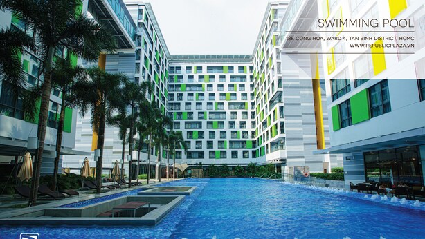 A swimming pool surrounded by modern buildings with a view of the sky. - Republic Plaza Serviced Apartment (Ho Chi Minh City)