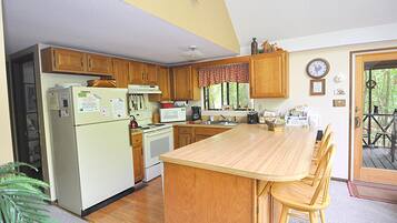 Cabin, Multiple Beds (Fox Hollow - Cozy Den with a Hot Tub ) | Private kitchen | Fridge, spices, freezer, paper towels
