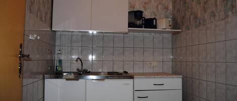 Fridge, coffee/tea maker, cookware/dishes/utensils