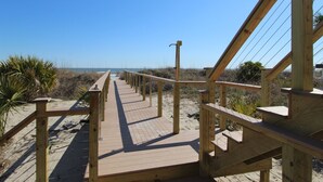 A wooden boardwalk leading to a beach with a clear sky. - Oceanfront home with Hot tub and pool table~ 915 W Ashley (Folly Beach)
