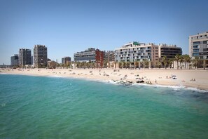 A beach with buildings in the background.