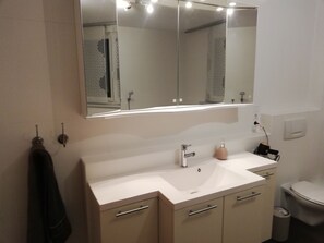 Bathtub, hair dryer, towels, soap