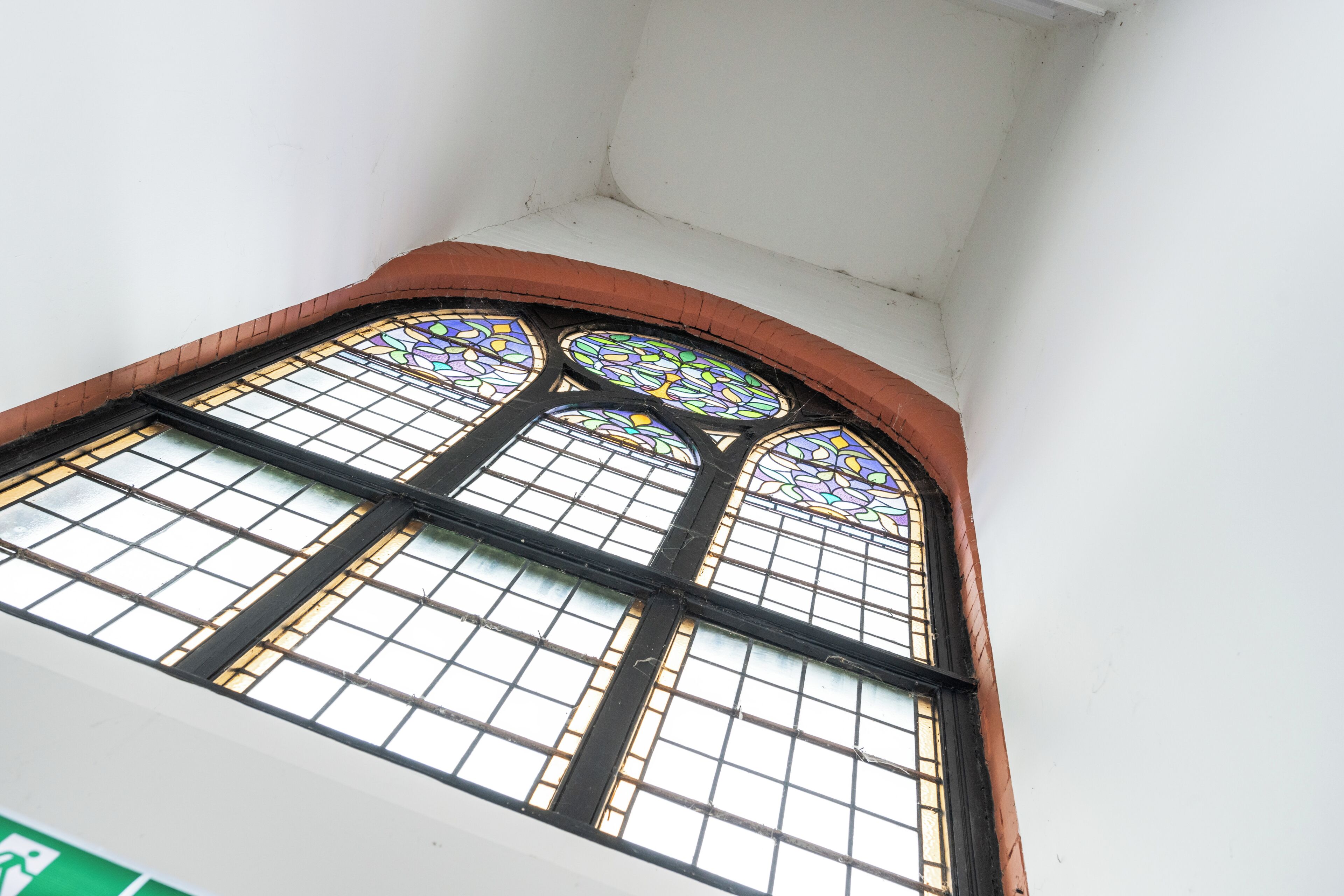 A stained glass window with a geometric pattern.