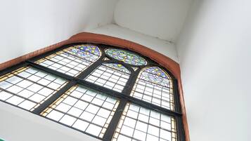 A stained glass window with a geometric pattern.