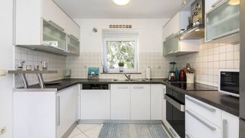 Apartment, 2 Bedrooms | Private kitchen | Full-sized fridge, microwave, oven, stovetop