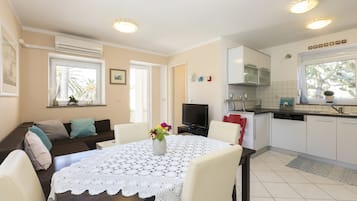 Apartment, 2 Bedrooms | Living area | Flat-screen TV