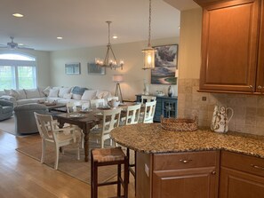 Cozy living area with a large dining table and comfortable seating, perfect for meals and relaxation.