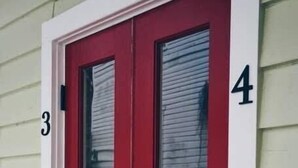 A red door with a glass panel and a handle, marked with the number 4. - Luxury Private Suite with HEATED SALTWATER POOL (65120 Viella,)