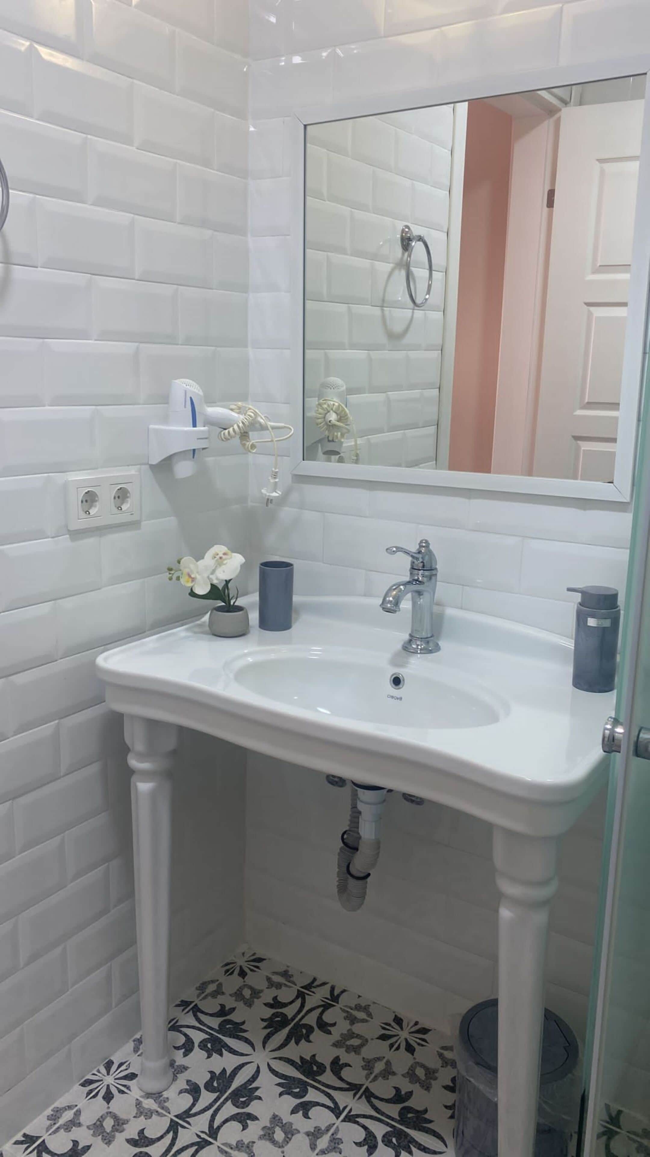 shower, hair dryer, bathrobes, slippers