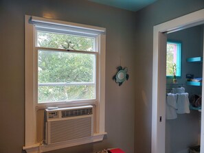 A bathroom with a window, a towel rack, and a potted plant. - OBX~Sunset View~Gazebo~Bike Path~Walk to Beach~Free Bikes & Kayaks~Super Clean!! (Kill Devil Hills)