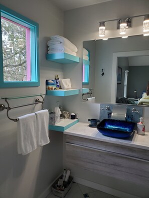 Shower, hair dryer, towels, soap