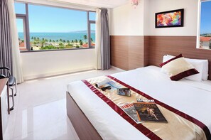Family Quadruple Room, 2 Queen Beds, Sea View | Minibar, in-room safe, desk, soundproofing - Arise Hotel (Nha Trang)
