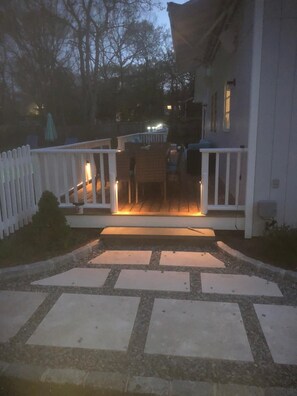 Step out onto the porch and enjoy the serene surroundings from the comfort of an outdoor space.