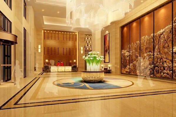 Experience the grandeur of our lobby, featuring a polished floor, elegant chandelier, and a stunning mural.