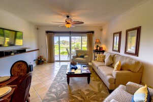 Deluxe Condo, 2 Bathrooms, Partial Ocean View | Living area | Flat-screen TV