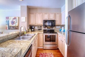 Condo (100-1_Lakeside_Village) | Private kitchen | Fridge, microwave, stovetop, dishwasher