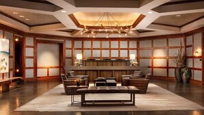 A spacious lobby with a central seating area, a reception desk, and a modern chandelier. - Platinum Vail Ritz-carlton 3 Bedroom Mountain Residence Just One Block From the Eagle Bahn Gondola (Vail)