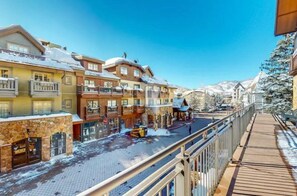 A snow-covered street with buildings, a wooden walkway, and a clear blue sky. - Luxury Vail Solaris Studio Vacation Rental Set at the Base of the Mountain Just Steps From the Gondola (Vail)