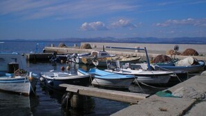 A marina with several boats docked at wooden piers. - Authentic Villa With Pool on the Island of Brac, Near the Beach (Supetar)