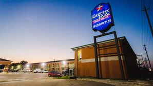 A building with a large sign for Express Gulf Bank. - Express Inn Gulf Bank (Houston)
