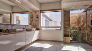 Shower, hair dryer, towels, soap