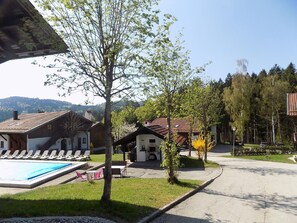 Enjoy a tranquil retreat with a clear view of the swimming pool and beautifully maintained grounds.