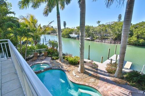 Luxury waterfront home with a heated pool and spa!