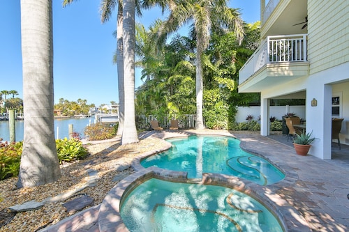 Luxury waterfront home with a heated pool and spa!