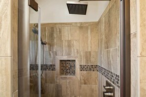 Bathtub, hair dryer, towels, shampoo