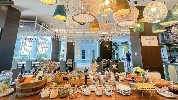 A breakfast buffet with various food items and a sign that reads "Good Morning Keep Breathing". - Kokotel Bangkok Dheva Thonglor (Bangkok)