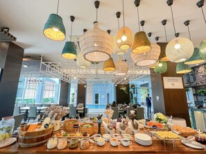 A breakfast buffet with various food items and a sign that reads "Good Morning Keep Breathing". - Kokotel Bangkok Dheva Thonglor (Bangkok)