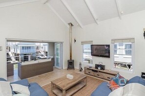 Standard Cottage, 3 Bedrooms | Living area | TV - Avocet Nest on Thesen Island (Knysna)