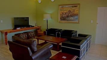 Deluxe Chalet, 2 Bedrooms | Living area | TV