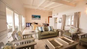 Standard Cottage, 4 Bedrooms | Living room | Flat-screen TV