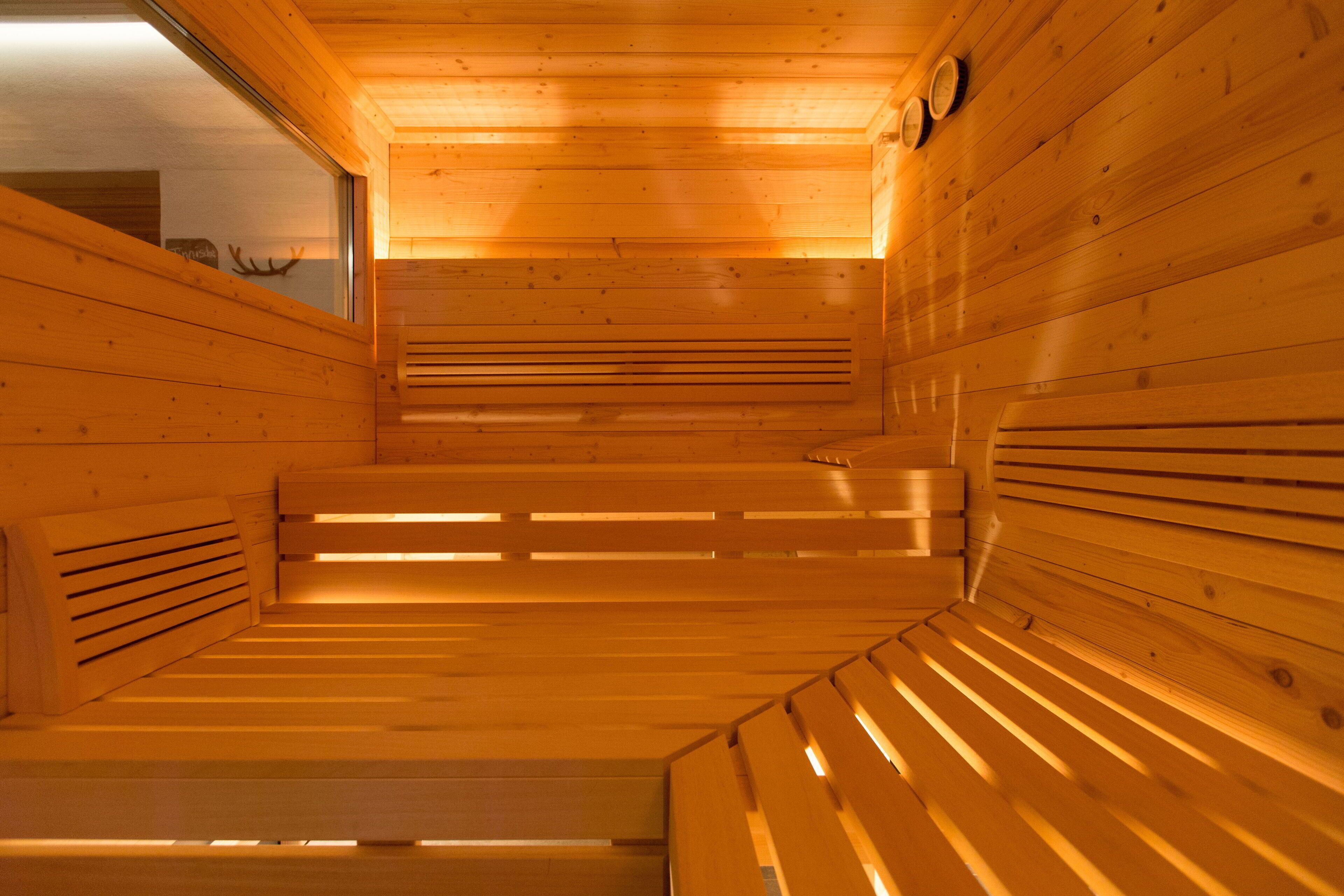 A sauna with wooden benches and slatted walls.