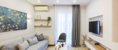 Apartment, 1 Bedroom | Living room | Smart TV