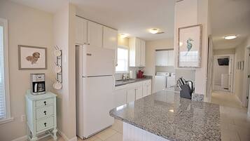 Fridge, microwave, toaster, cookware/dishes/utensils