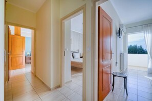 Relax in this stylish room with a large bed, balcony, and serene views.