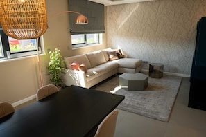 Elite Apartment | Living room | 80-cm TV with satellite channels