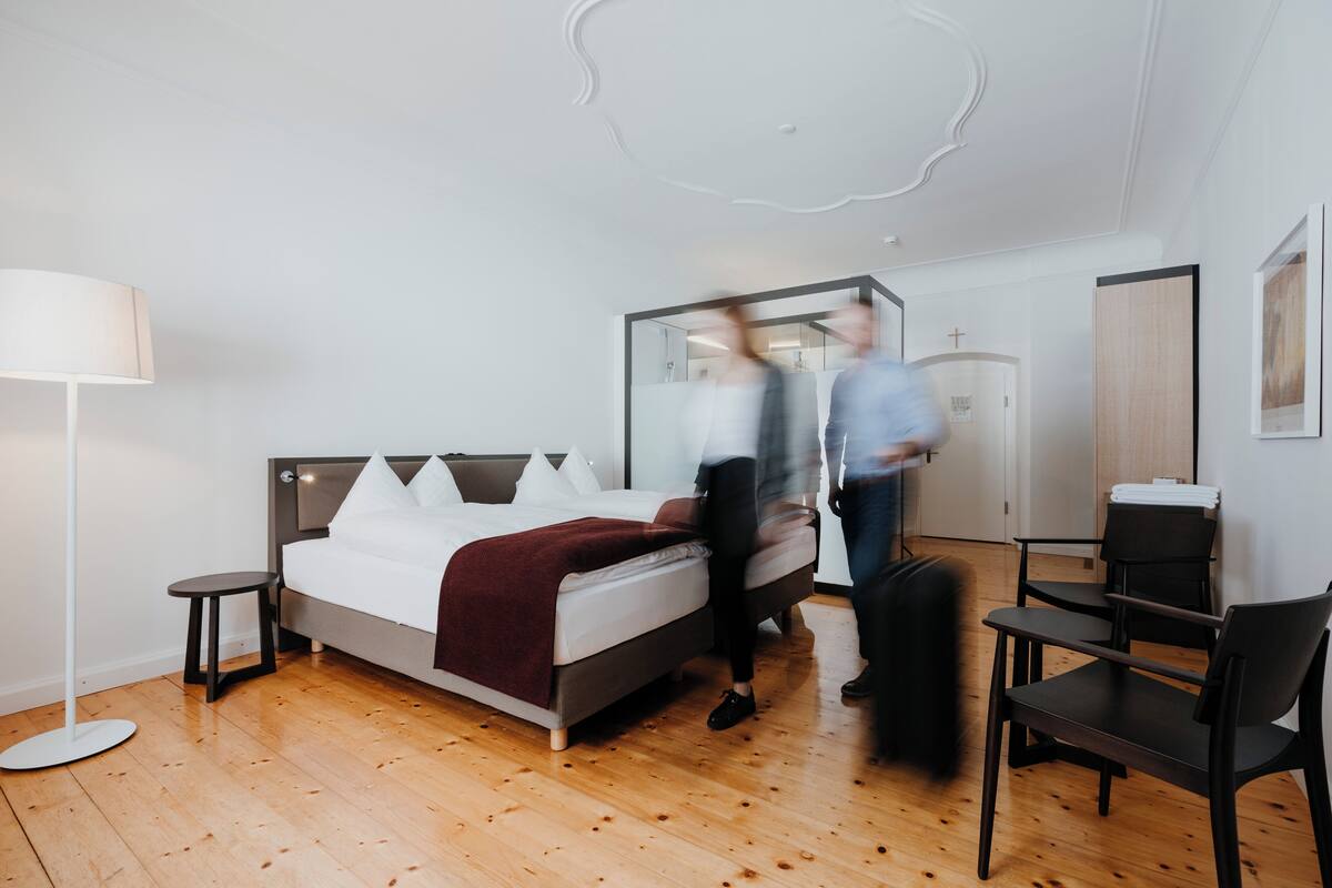 Premium bedding, desk, laptop workspace, blackout curtains