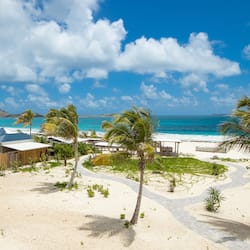 On the beach, white sand, sun-loungers, beach umbrellas