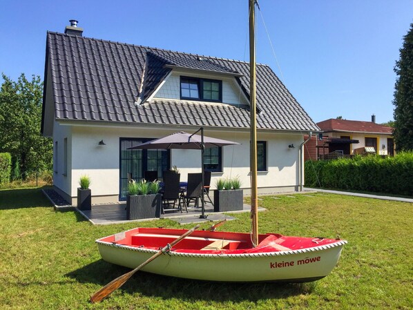 Relax on the patio with outdoor furniture and enjoy leisure activities from the house.