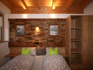 Cozy retreat with a rustic headboard and shelving unit, featuring a plush bed with patterned bedding and multiple pillows.