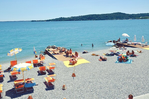 On the beach, sun-loungers