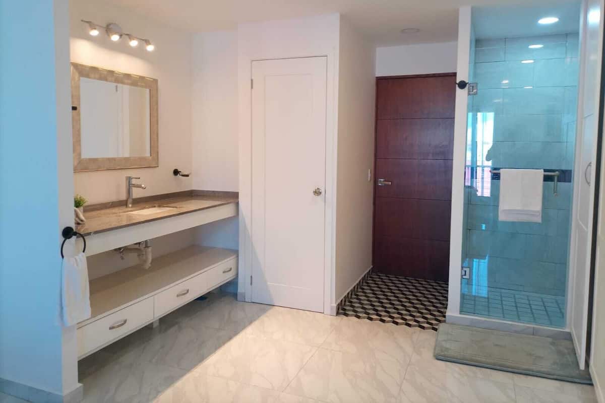 Shower, rainfall showerhead, eco-friendly toiletries, hair dryer