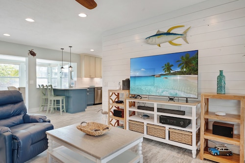 Seabatical -Beachy Chic Canalfront Home with Large Pool with Spa & boat Dock!