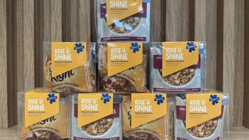 A display of Rise & Shine breakfast cereals in a store.