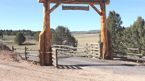 A rustic wooden archway with a sign reading "Sevier River Ranch & Cattle Company." - Tack Room Studio on 280 acre Sevier River Ranch - 1 King and 2 Twin Beds (Hatch)