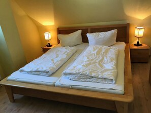 Cozy retreat with a double bed, two nightstands, and table lamps.