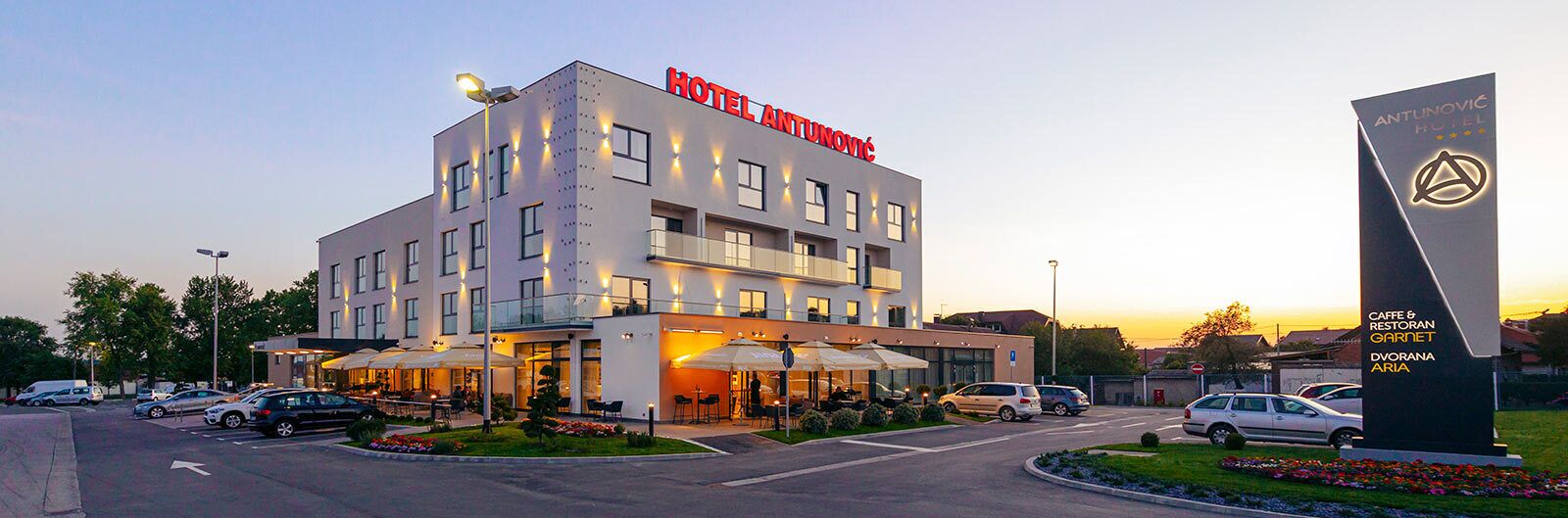 A modern hotel with a prominent sign reading "HOTEL ANTUNOVIĆ".